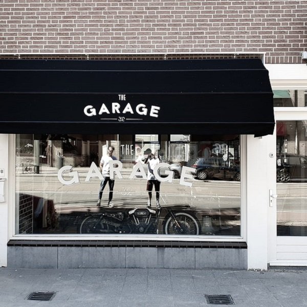 Markies buitenzonwering in Rotterdam, markies met reclame bij barbier Joost Mulleman, Teh Garage